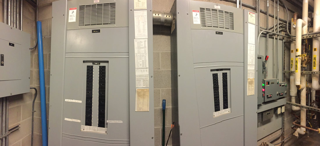 2 panels of circuit breakers in the locker room